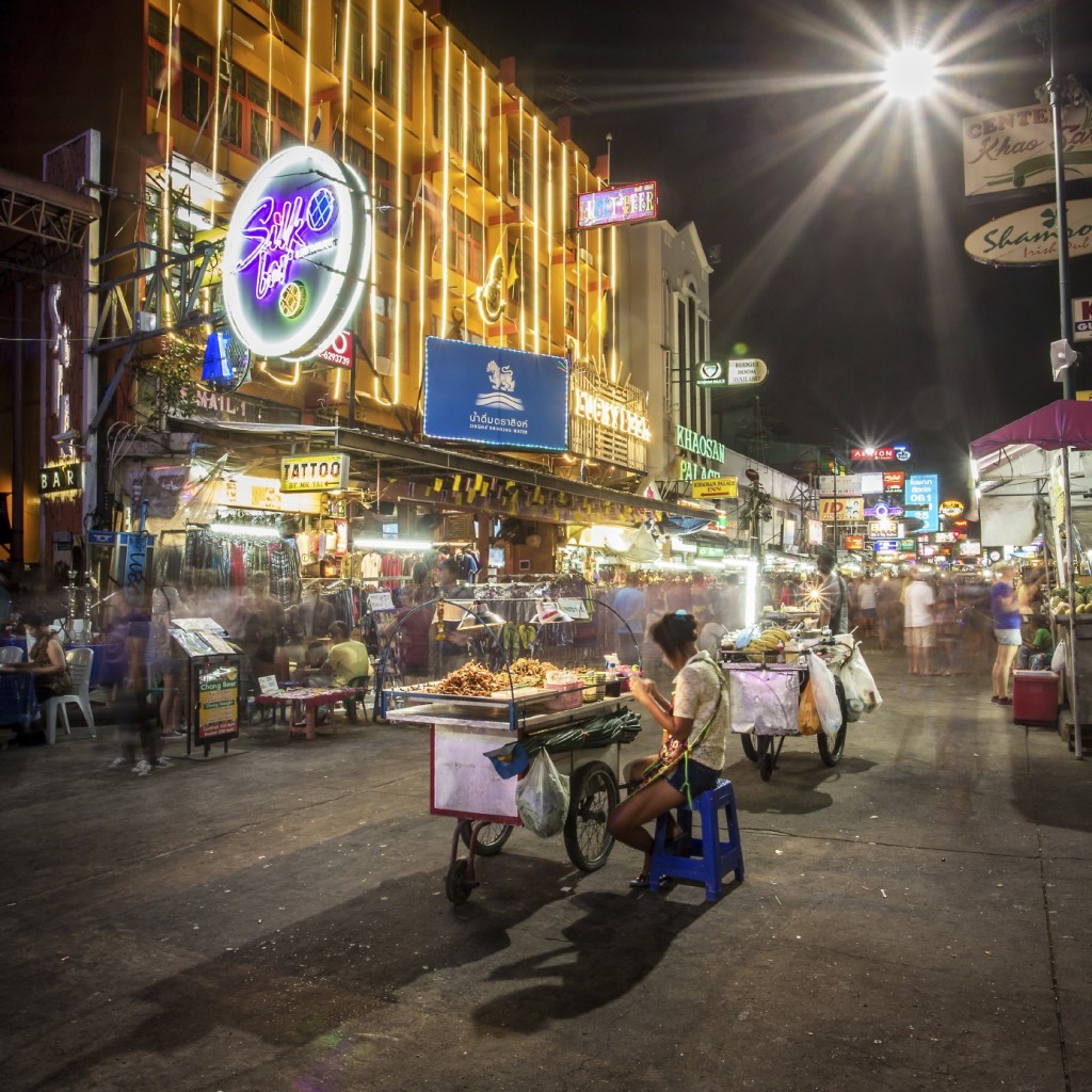 BANGKOK - APRIL 21, 2014: Street food vendor and tourist shops o